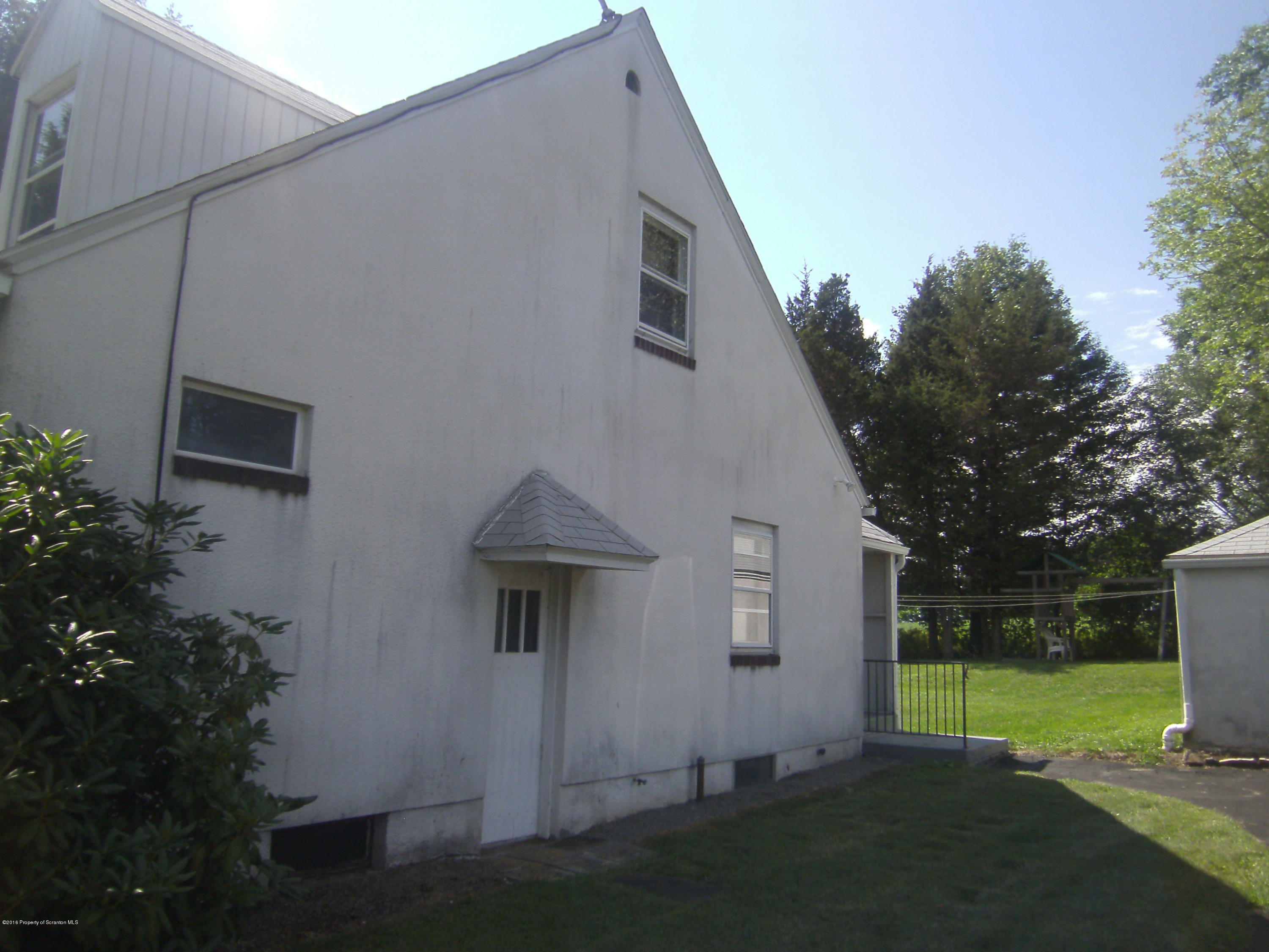 855 Becks Crossing Road Moscow, PA 18444 - Photo 41 of 43 a view of a house with backyard and garden