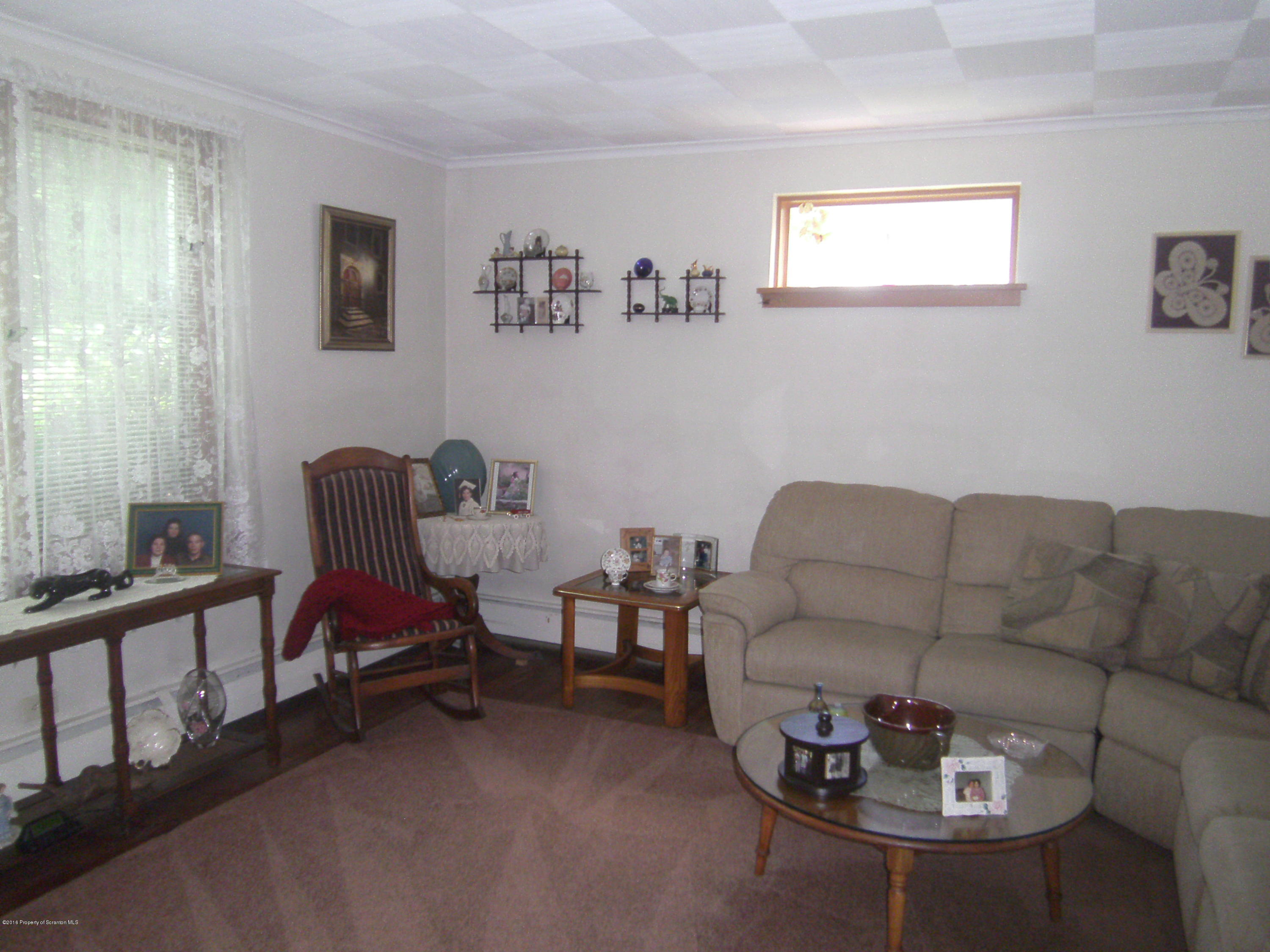 855 Becks Crossing Road Moscow, PA 18444 - Photo 6 of 43 a living room with furniture and a window