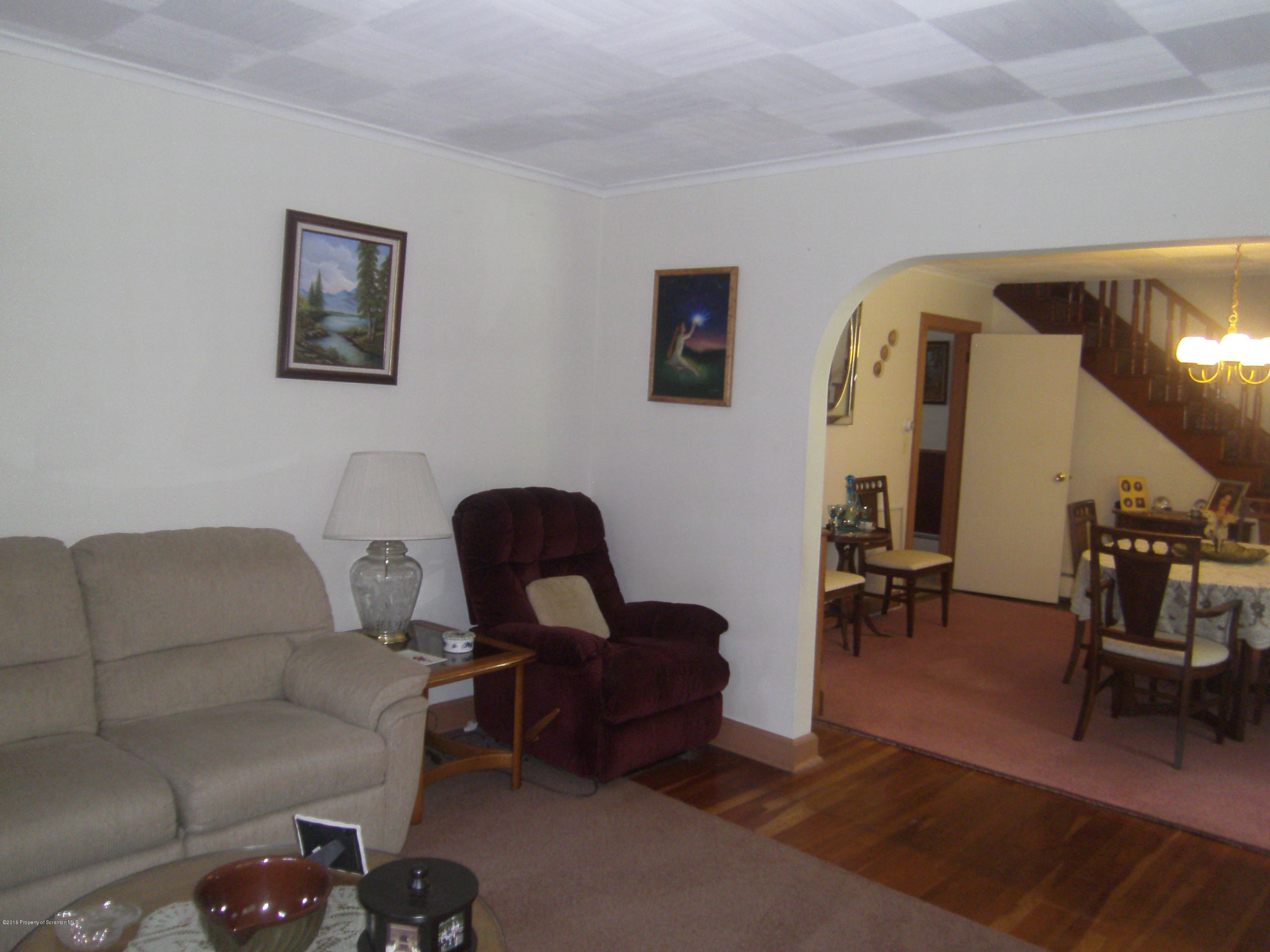 855 Becks Crossing Road Moscow, PA 18444 - Photo 7 of 43 a living room with furniture and a piano