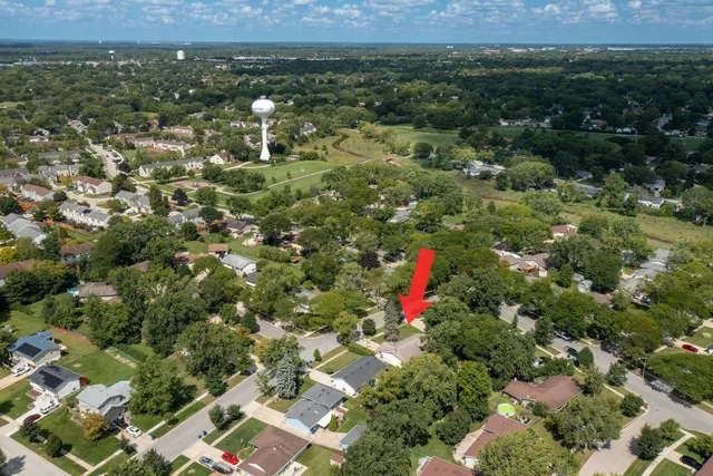 a view of a houses with a lush green hillside