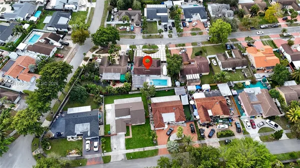 an aerial view of a house with a garden
