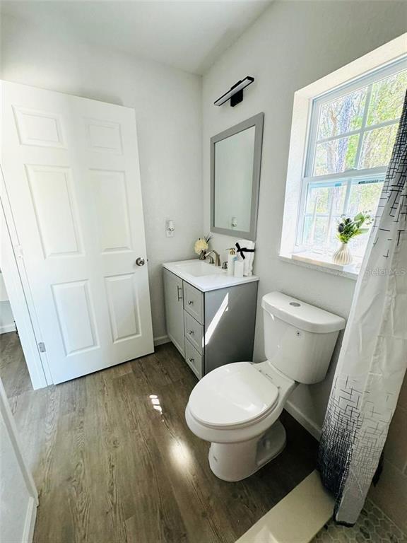 13731 Southwest 89 Circle Ocala, FL 34473 - Photo 20 of 21 a white toilet sitting next to a bathroom sink