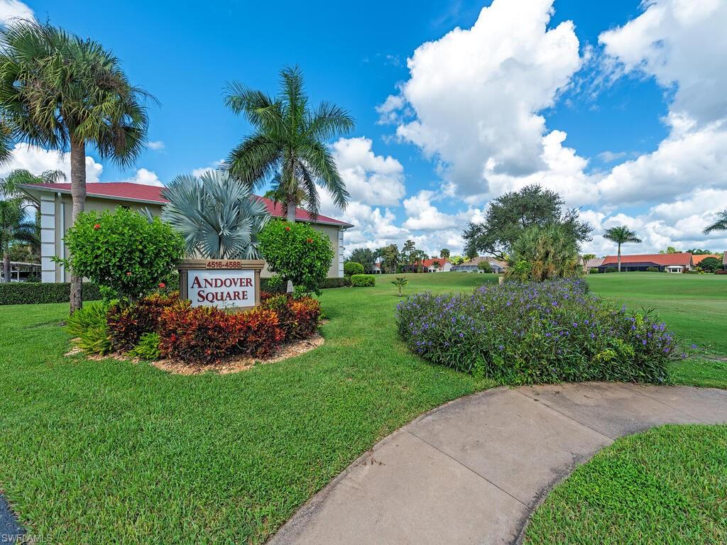 4556 Andover Way, Unit E104 Naples, FL 34112 - Photo 12 of 12 a view of a garden with palm trees