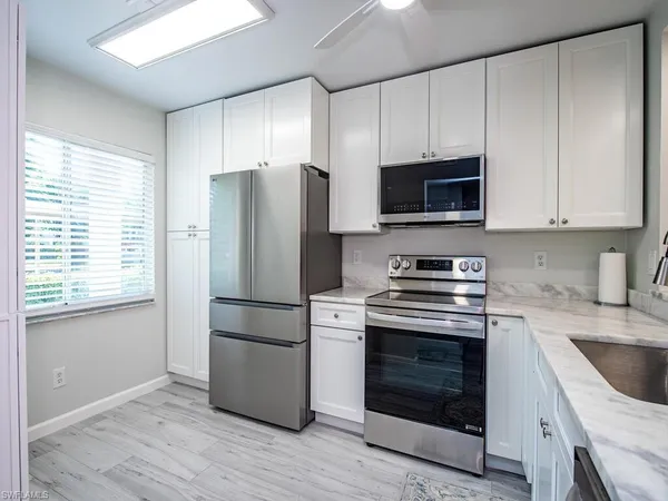 a kitchen with a stove microwave and a refrigerator