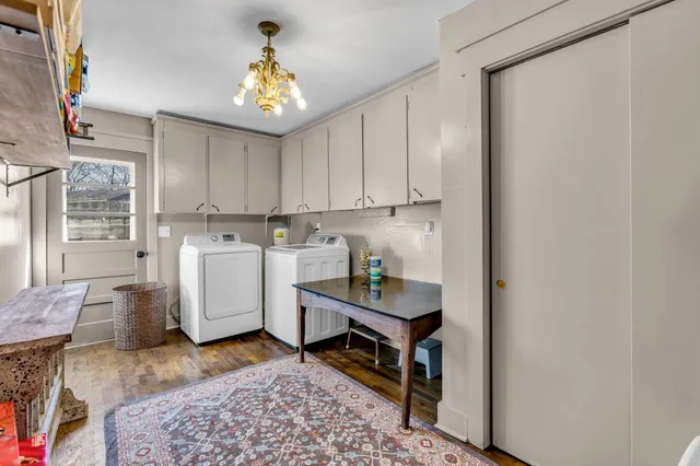 a bed room with a bed window and flat screen tv