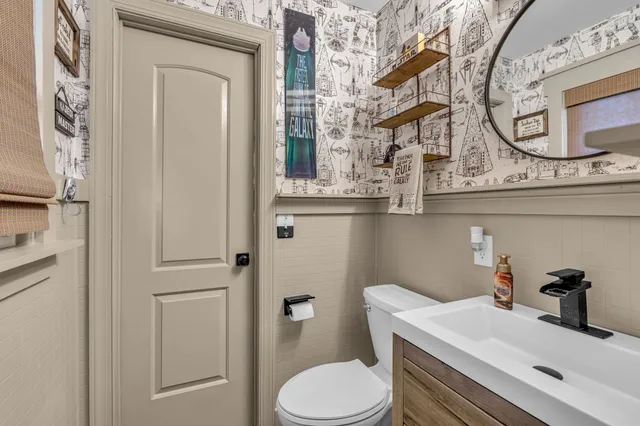 a bedroom with furniture and a window