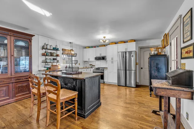 a kitchen with stainless steel appliances a refrigerator sink and stove
