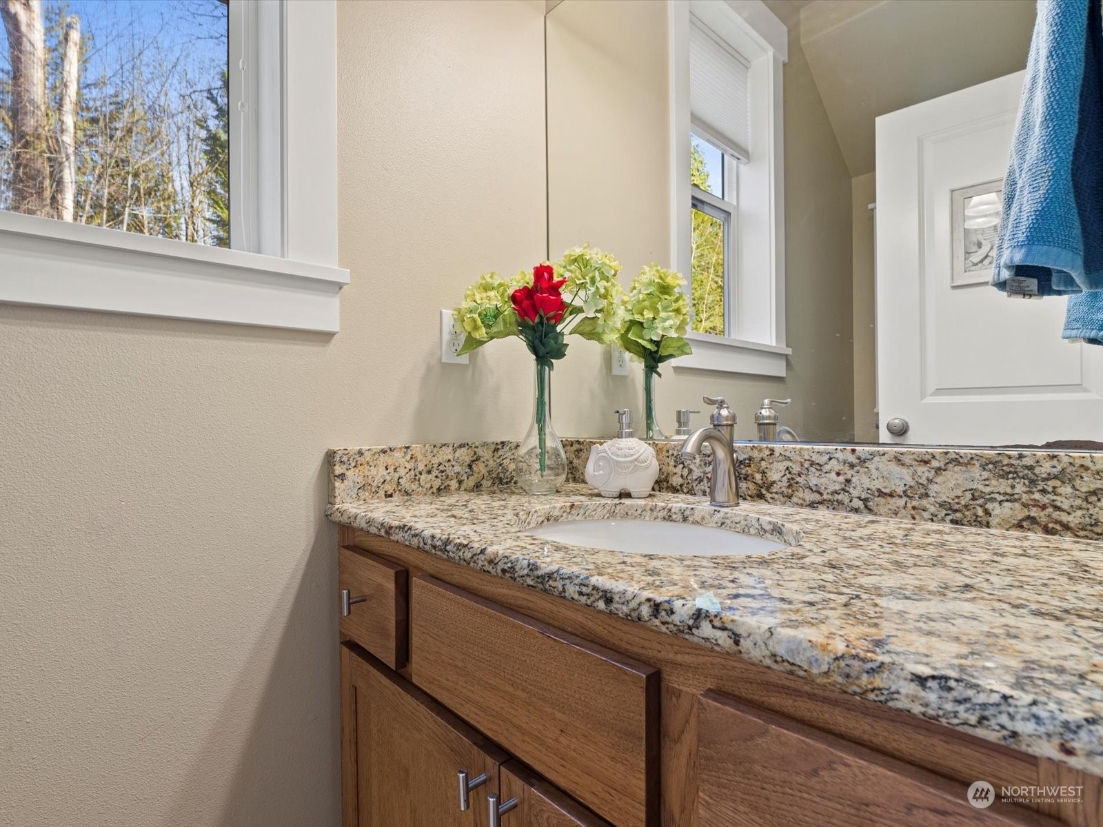 4831 Northeast 13th Place Renton, WA 98059 - Photo 12 of 24 a bathroom with a granite countertop sink and a mirror