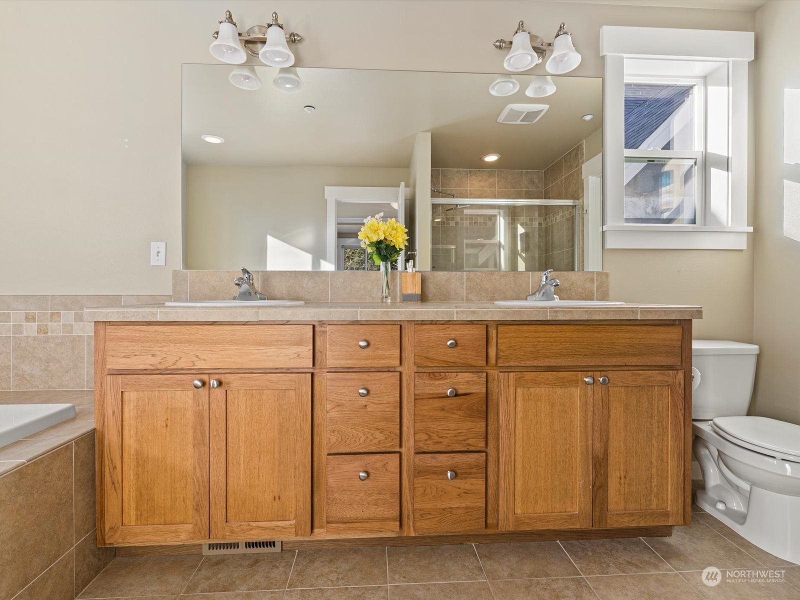4831 Northeast 13th Place Renton, WA 98059 - Photo 16 of 24 a bathroom with a sink vanity granite and a mirror