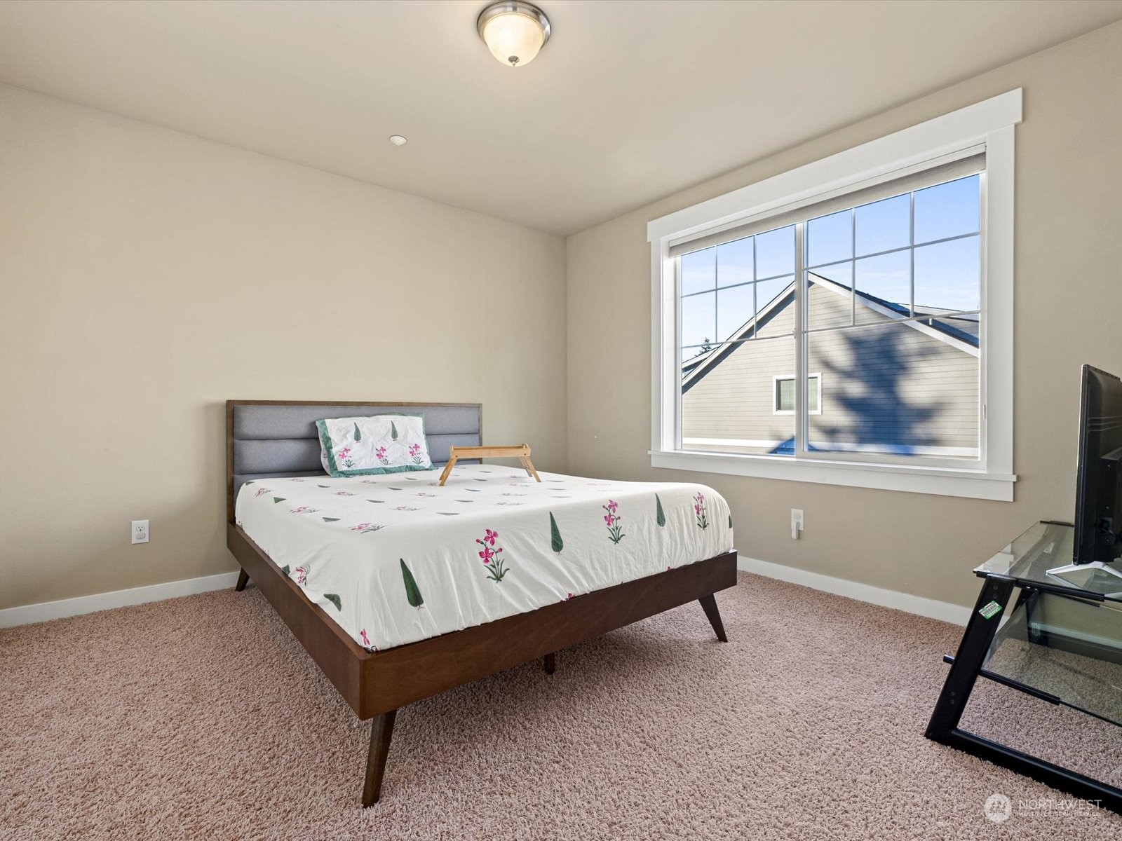 4831 Northeast 13th Place Renton, WA 98059 - Photo 19 of 24 a bedroom with a bed and window