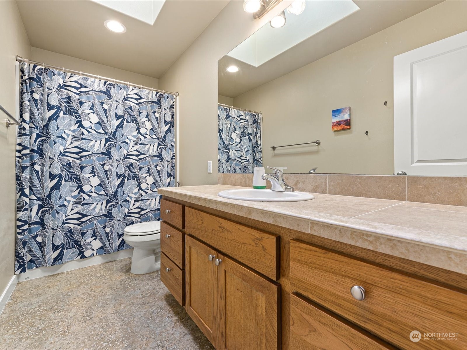 4831 Northeast 13th Place Renton, WA 98059 - Photo 21 of 24 a bathroom with a sink and a mirror