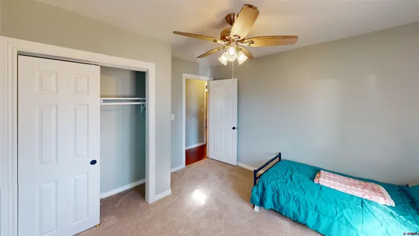 a view of a hallway with a closet