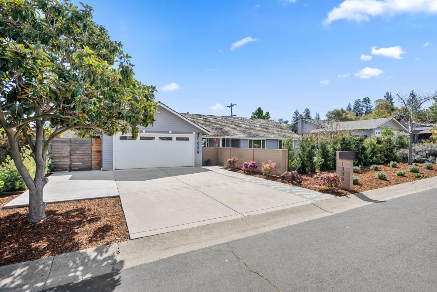1999 Scott Lane Los Altos, CA 94024 - Photo 2 of 44 a front view of a house with a yard and mountain view