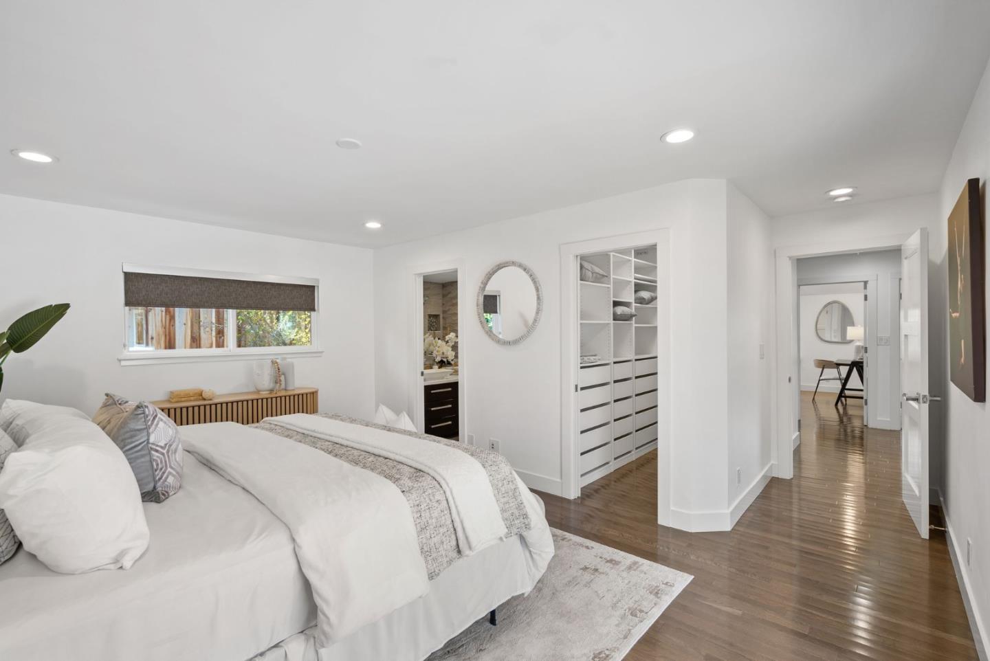 1999 Scott Lane Los Altos, CA 94024 - Photo 21 of 44 a spacious bedroom with a bed and a walk in closet
