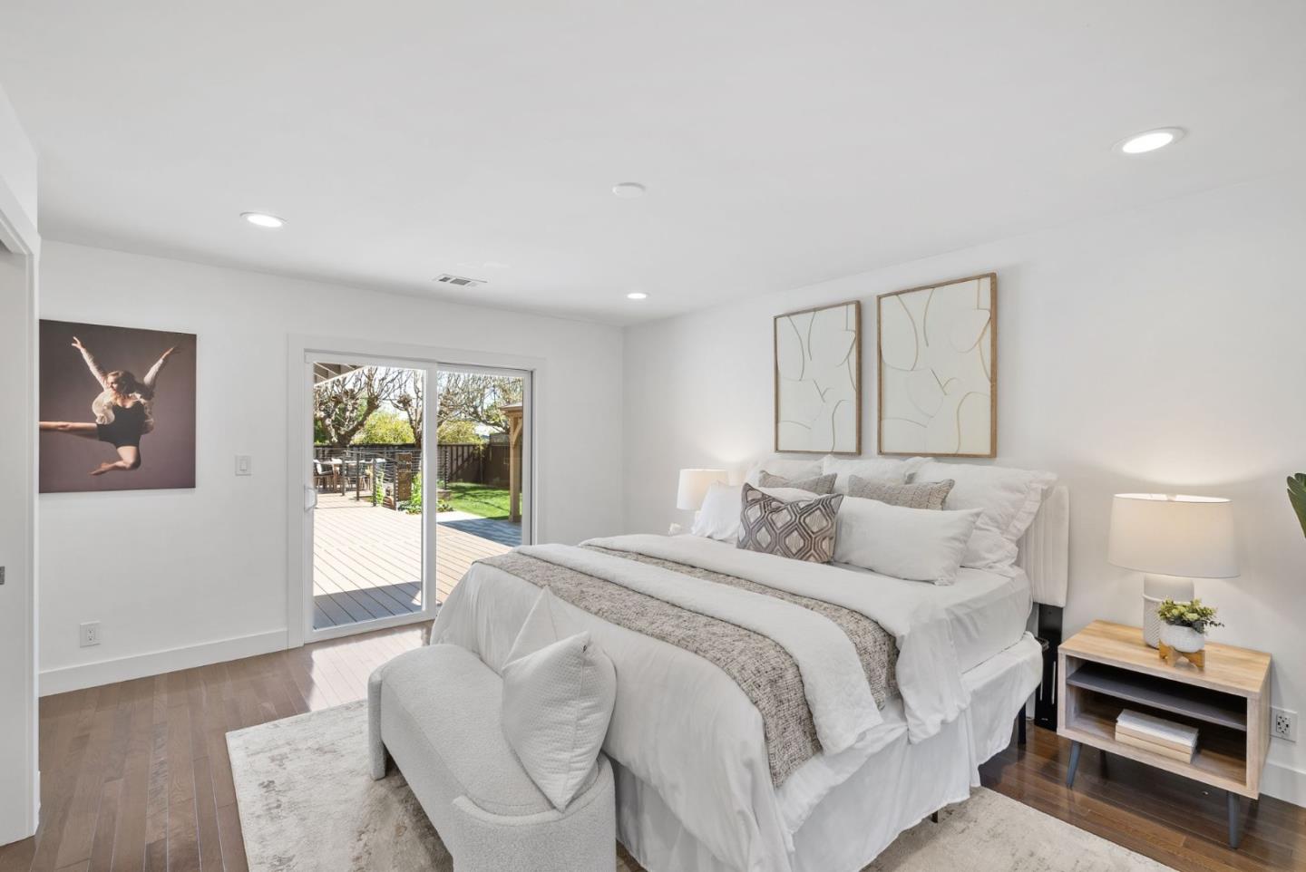 1999 Scott Lane Los Altos, CA 94024 - Photo 23 of 44 a spacious bedroom with a large bed and a window