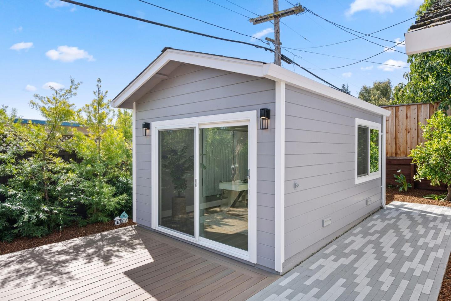 1999 Scott Lane Los Altos, CA 94024 - Photo 39 of 44 a yellow house with potted plants in front of door