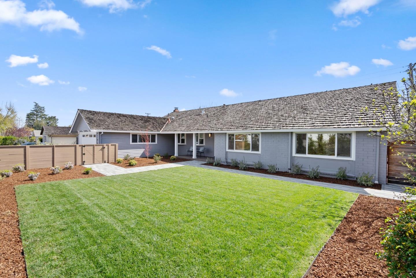 1999 Scott Lane Los Altos, CA 94024 - Photo 43 of 44 a front view of a house with a garden and trees