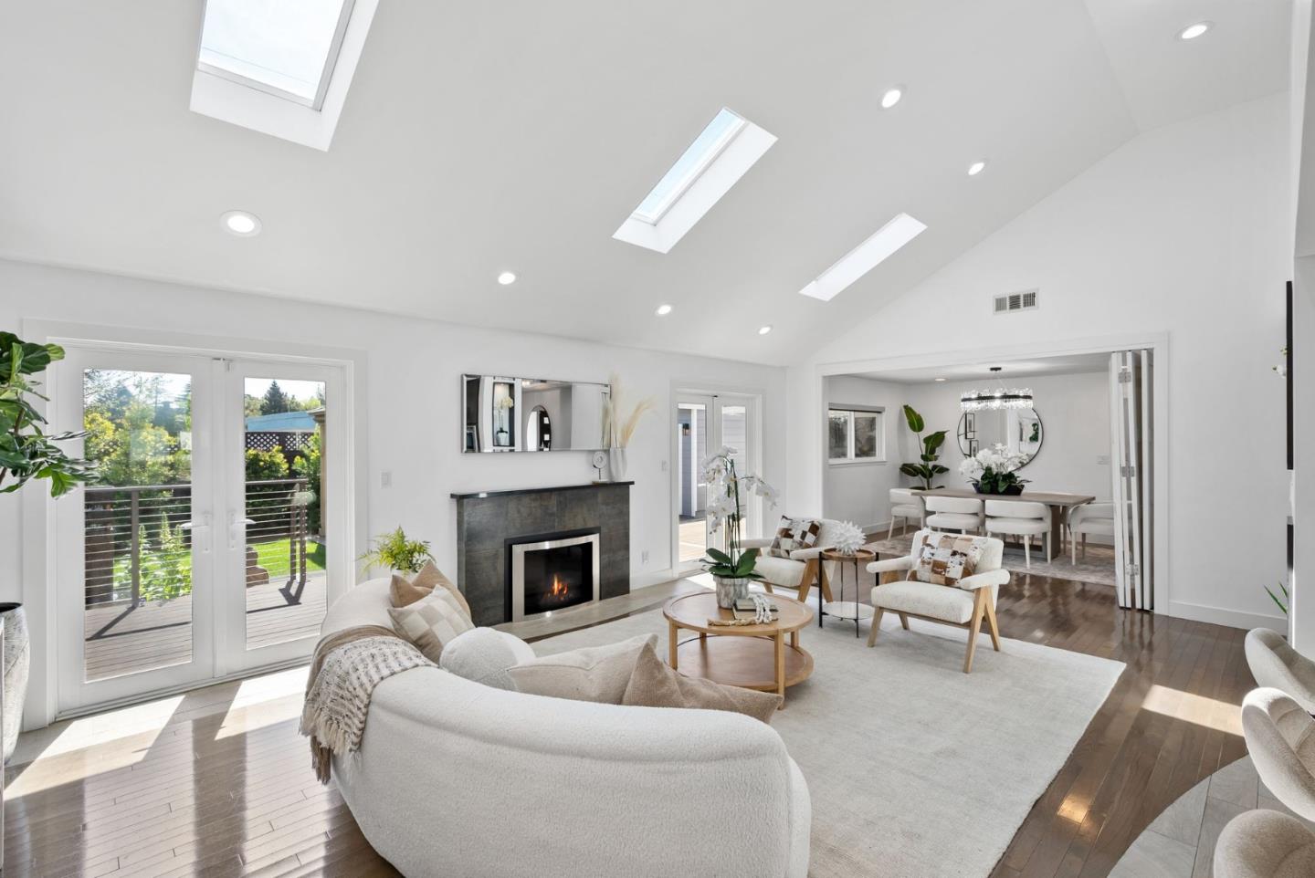 1999 Scott Lane Los Altos, CA 94024 - Photo 8 of 44 a living room with furniture fireplace and a large window