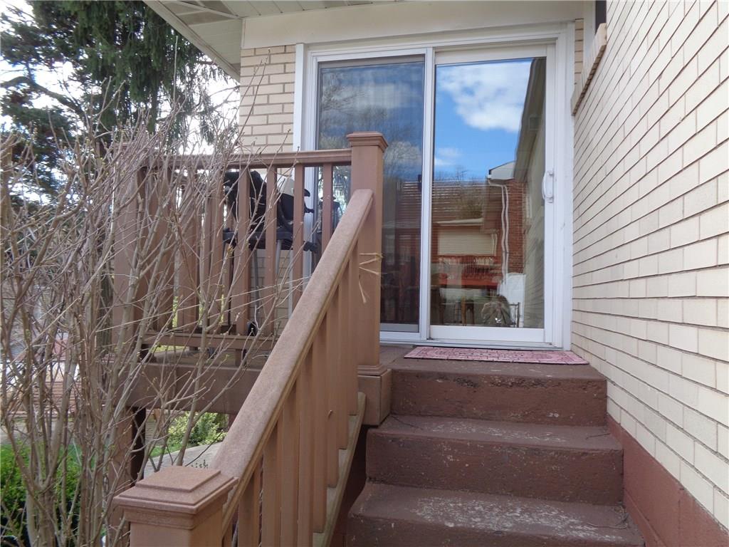 124 KIngs Road Braddock Hills, PA 15221 - Photo 21 of 25 Sliding glass door leading to sunroom