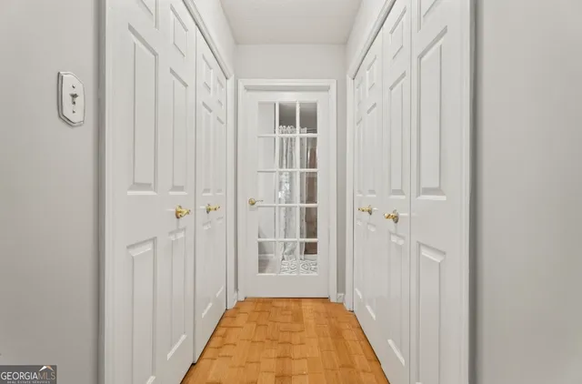 a bathroom with a sink and a mirror with window