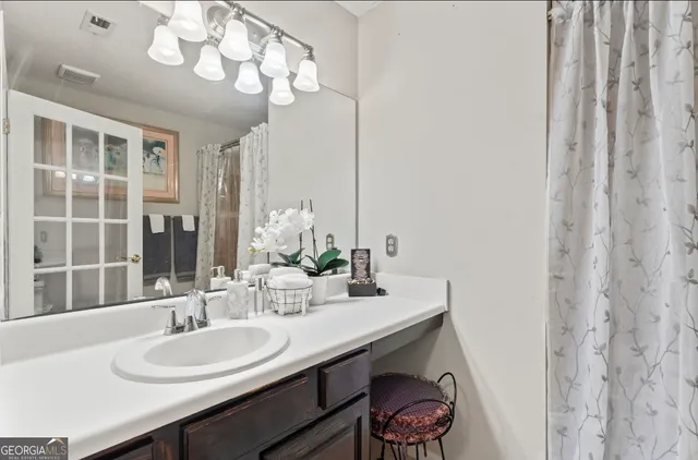 a bathroom with a toilet and shower