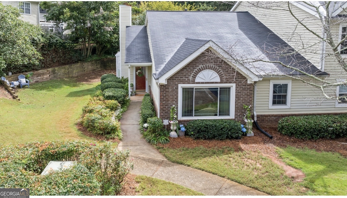 81 Hampshire Court Avondale Estates, GA 30002 - Photo 2 of 50 a front view of a house with garden