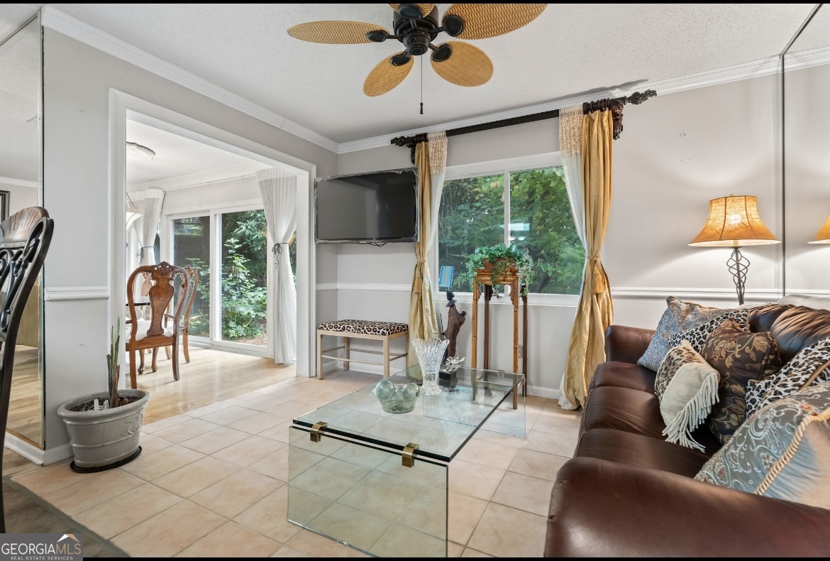 81 Hampshire Court Avondale Estates, GA 30002 - Photo 22 of 50 a living room with furniture and a potted plant