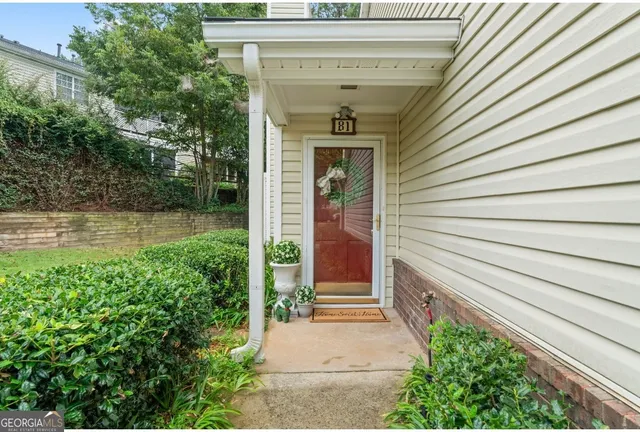 a bathroom with a glass door and shower