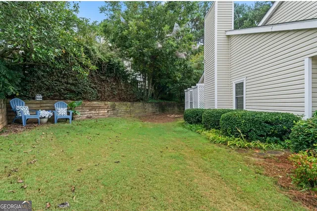 a backyard of a house with lots of green space