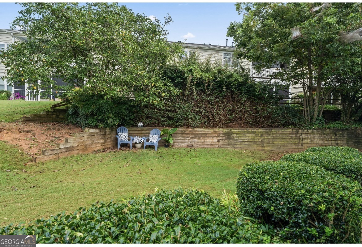 81 Hampshire Court Avondale Estates, GA 30002 - Photo 28 of 50 a backyard of a house with lots of green space