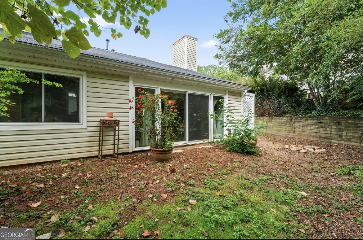 81 Hampshire Court Avondale Estates, GA 30002 - Photo 29 of 50 a front view of a house with garden
