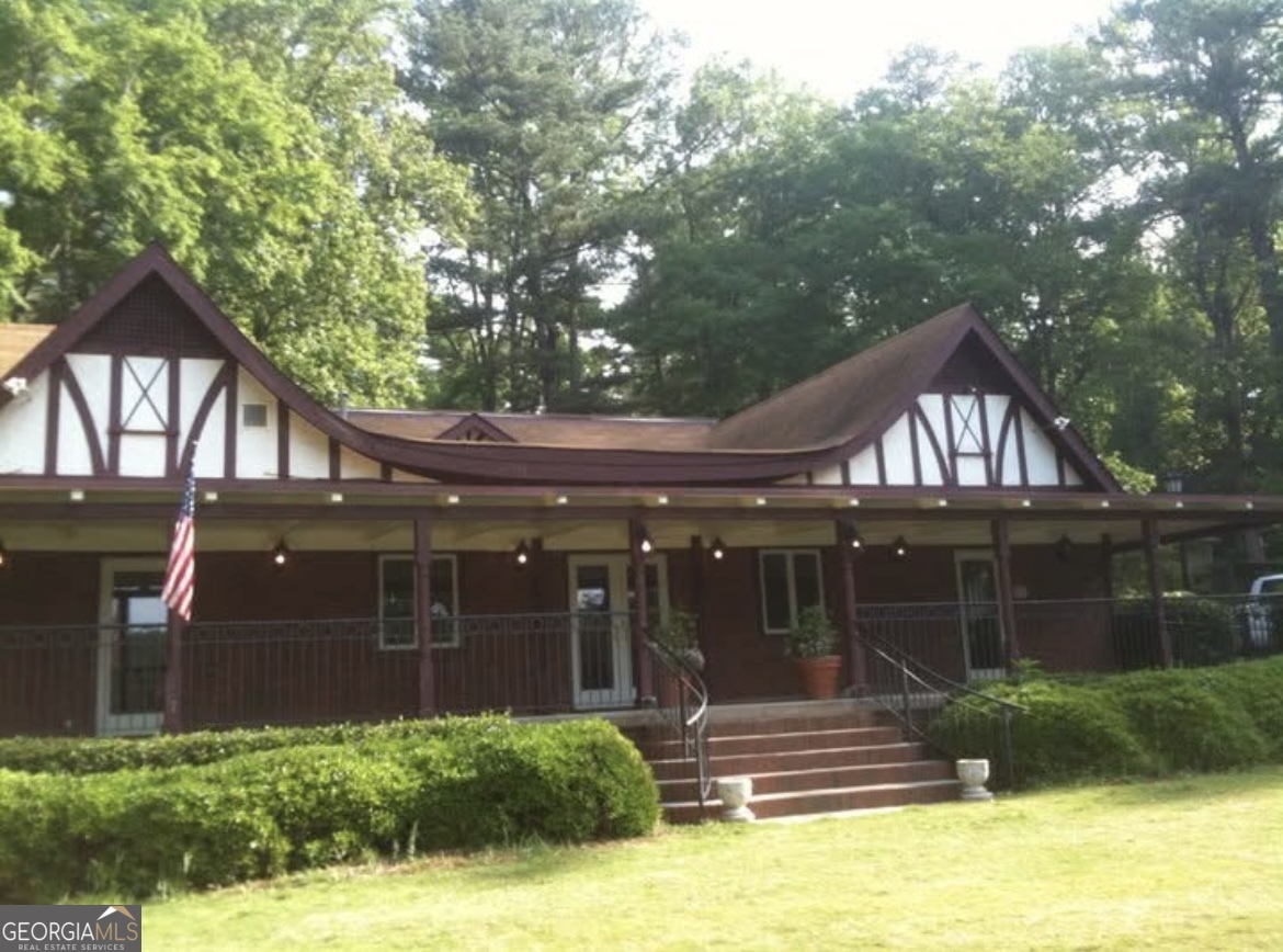 81 Hampshire Court Avondale Estates, GA 30002 - Photo 46 of 50 a front view of house with yard and green space