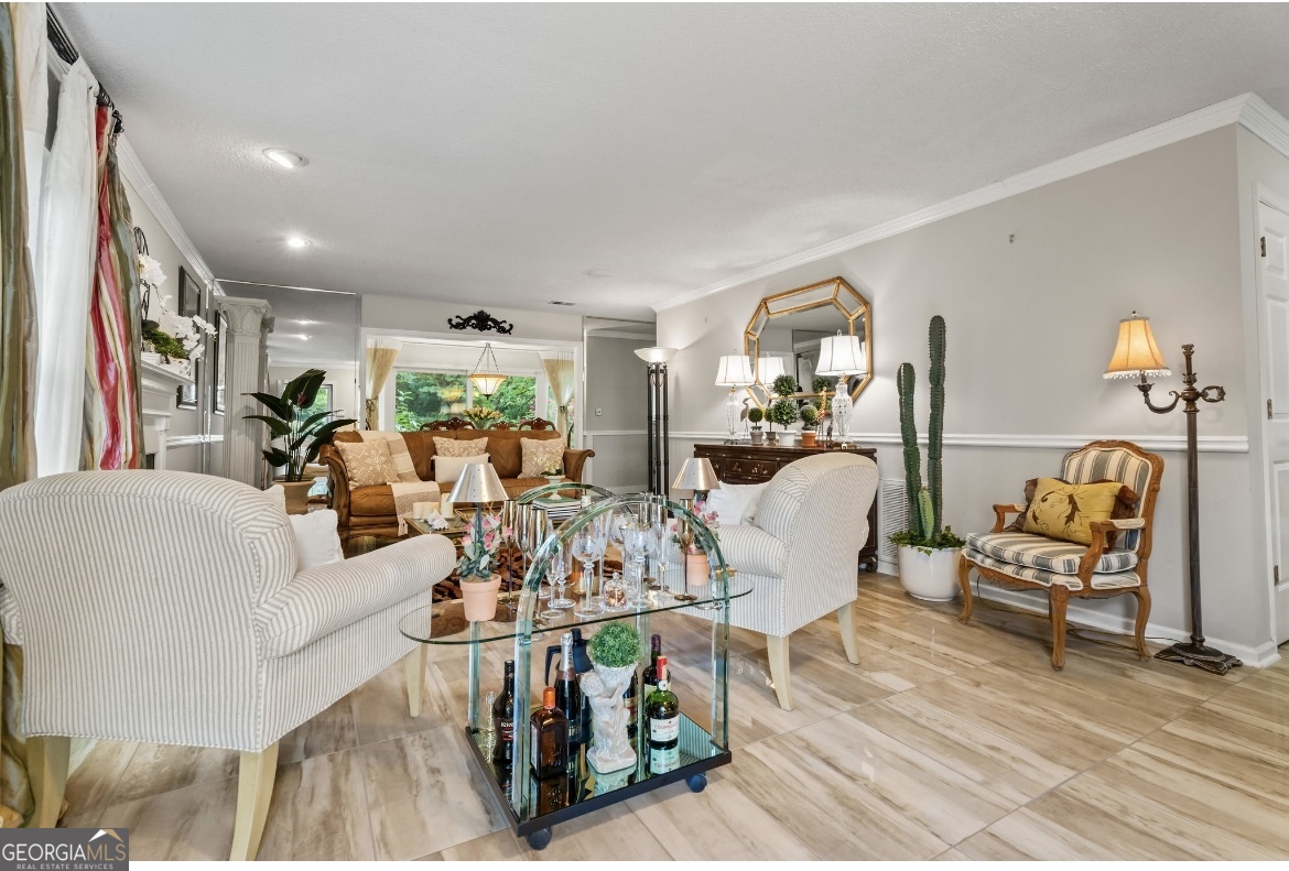81 Hampshire Court Avondale Estates, GA 30002 - Photo 7 of 50 a living room with furniture and a large window