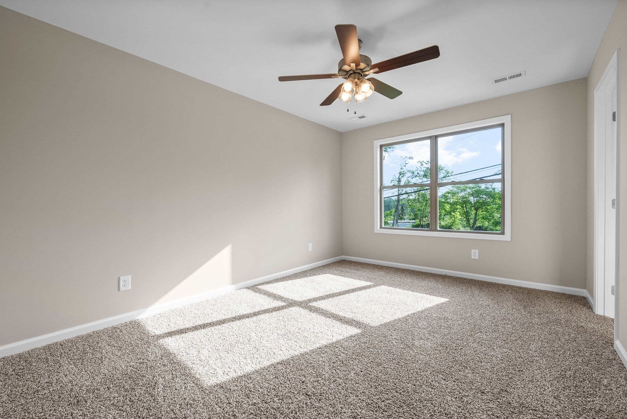 106 Colson Road Dover, TN 37058 - Photo 12 of 26 a view of a big room with windows and chandelier fan