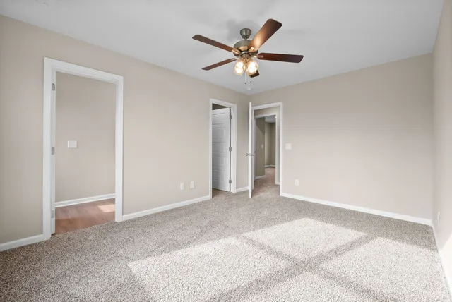 a bathroom with a sink a light fixture and a mirror
