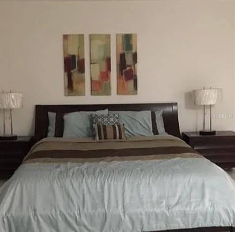 100 Lincoln Road, Unit 332 Miami Beach, FL 33139 - Photo 11 of 14 a bedroom with a bed and window