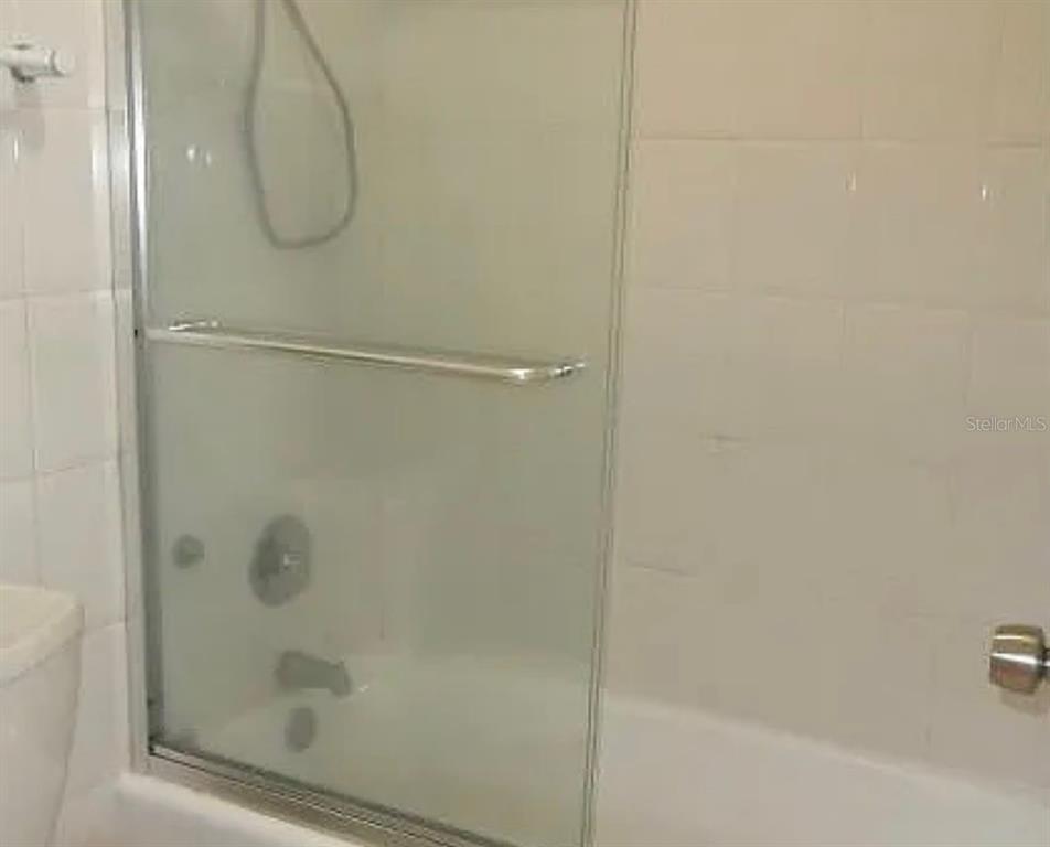 100 Lincoln Road, Unit 332 Miami Beach, FL 33139 - Photo 13 of 14 a bathroom with a glass shower door