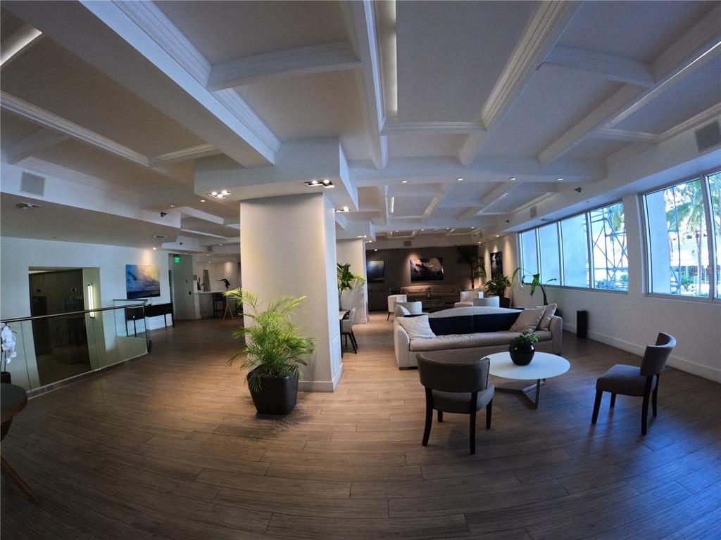 100 Lincoln Road, Unit 332 Miami Beach, FL 33139 - Photo 4 of 14 a living room with furniture and a potted plant