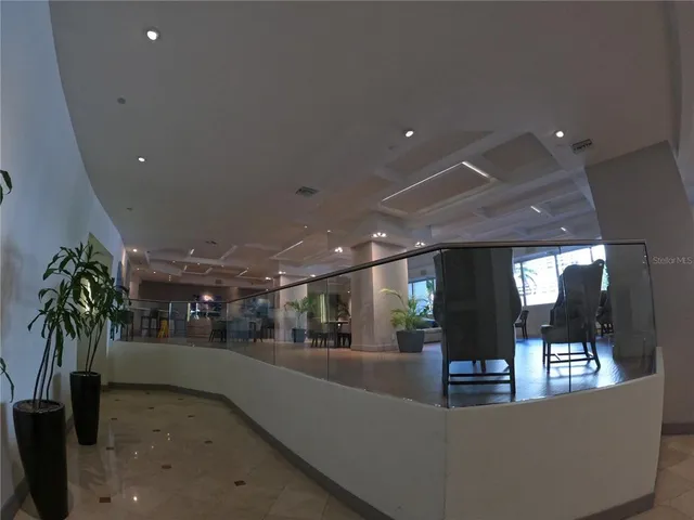 a view of a lobby with black carpet