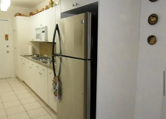 a living room with furniture and a gate