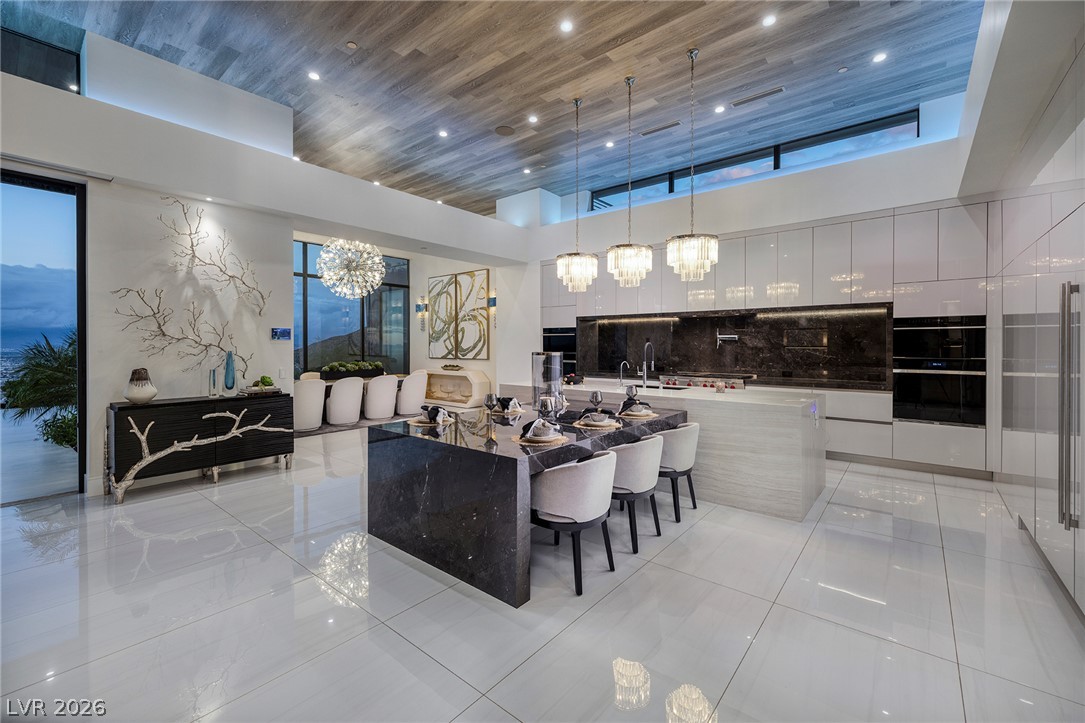 611 Cityview Ridge Drive Henderson, NV 89012 - Photo 25 of 66 Gleaming tile floors and a wood-paneled ceiling frame this modern culinary space.