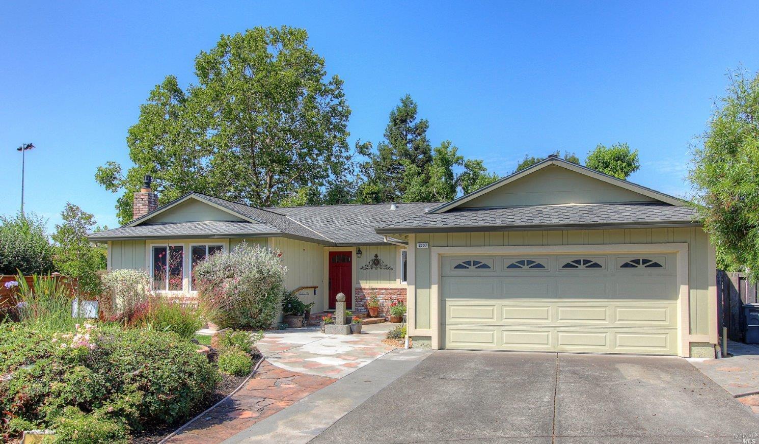 2350 Floral Way Santa Rosa, CA 95403 - Photo 1 of 1 a front view of a house with a garden and plants