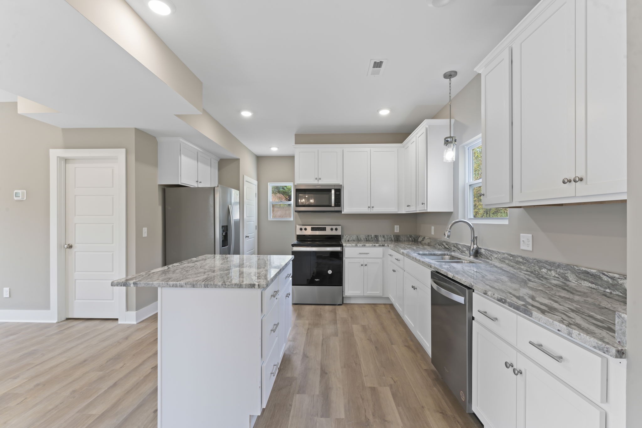 4357 Surji Circle Centerville, TN 37033 - Photo 12 of 25 a large kitchen with granite countertop a large counter top stainless steel appliances and cabinets