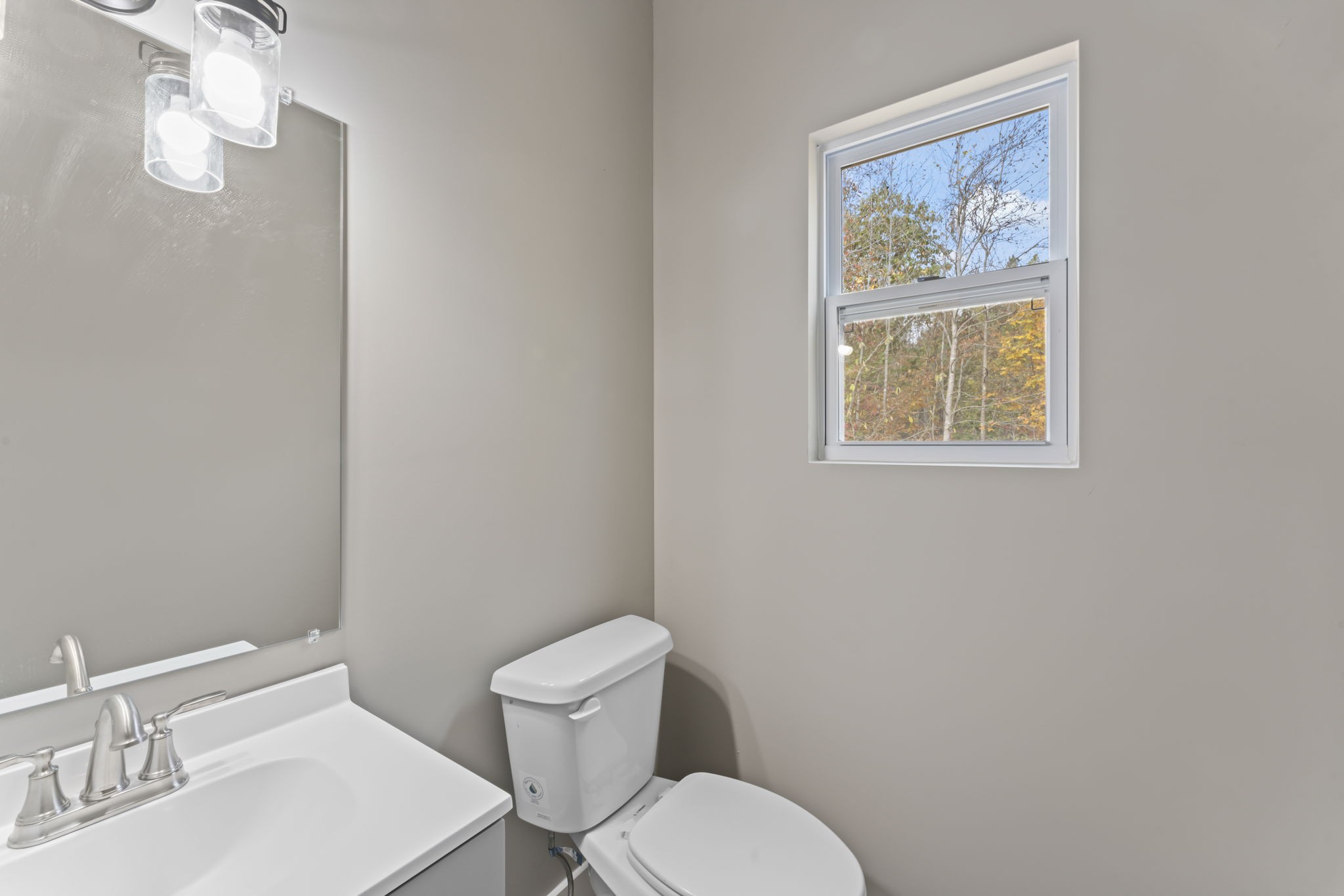 4357 Surji Circle Centerville, TN 37033 - Photo 15 of 25 a white toilet sitting next to a bathroom sink