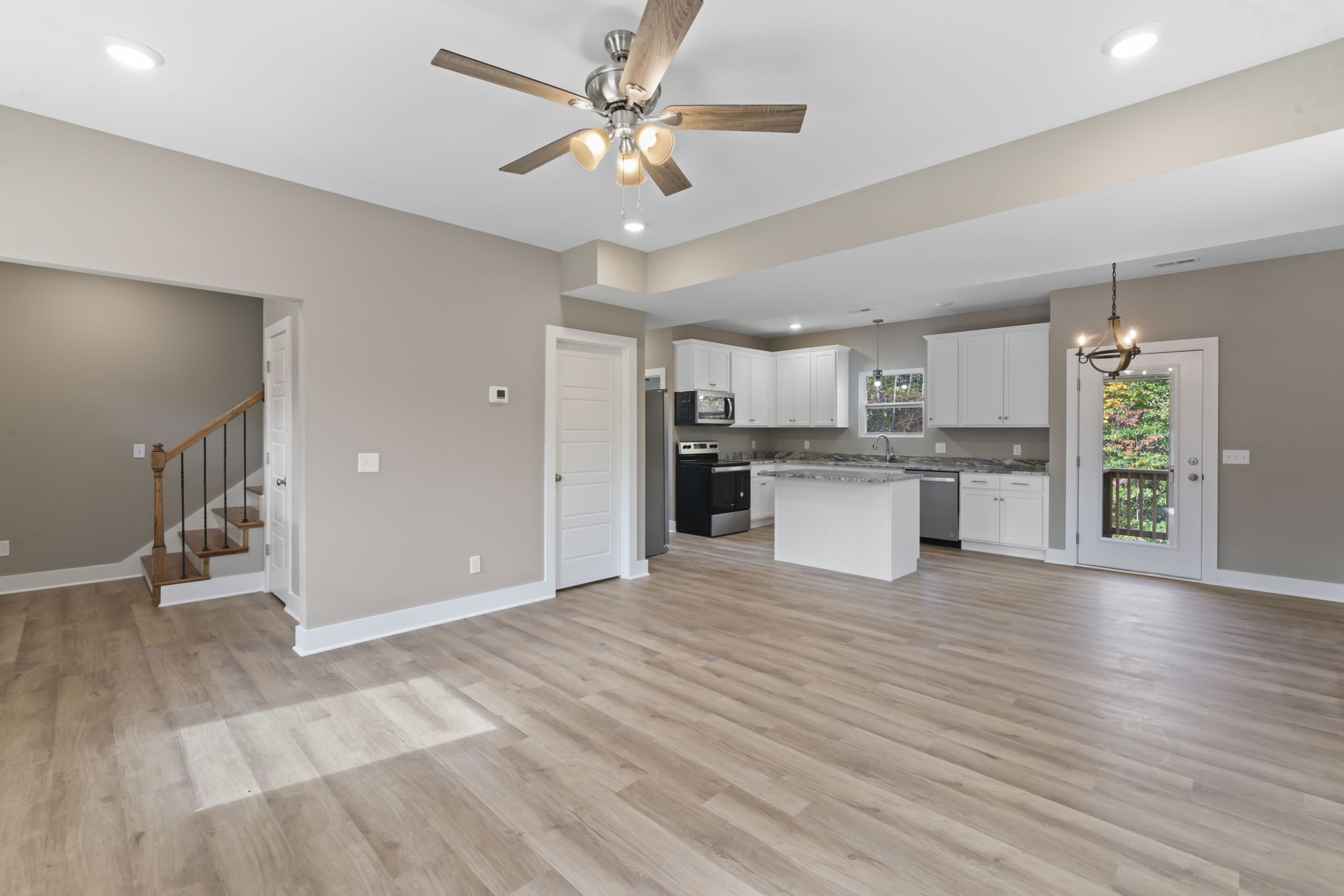 4357 Surji Circle Centerville, TN 37033 - Photo 6 of 25 a view of a kitchen with a sink and a refrigerator