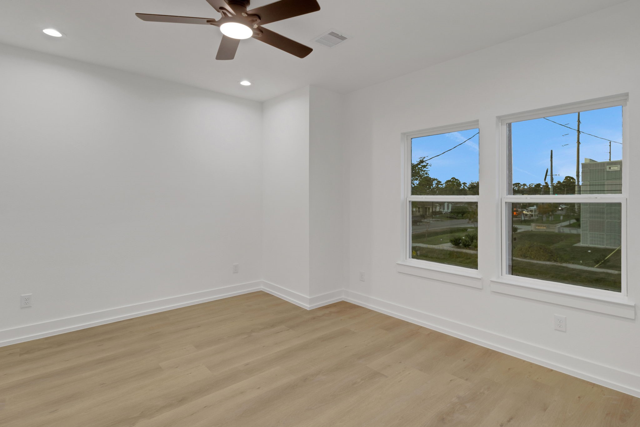 4202 Plaag Street Houston, TX 77016 - Photo 35 of 38 Another secondary bedroom with dual windows and modern ceiling fan for added comfort.
