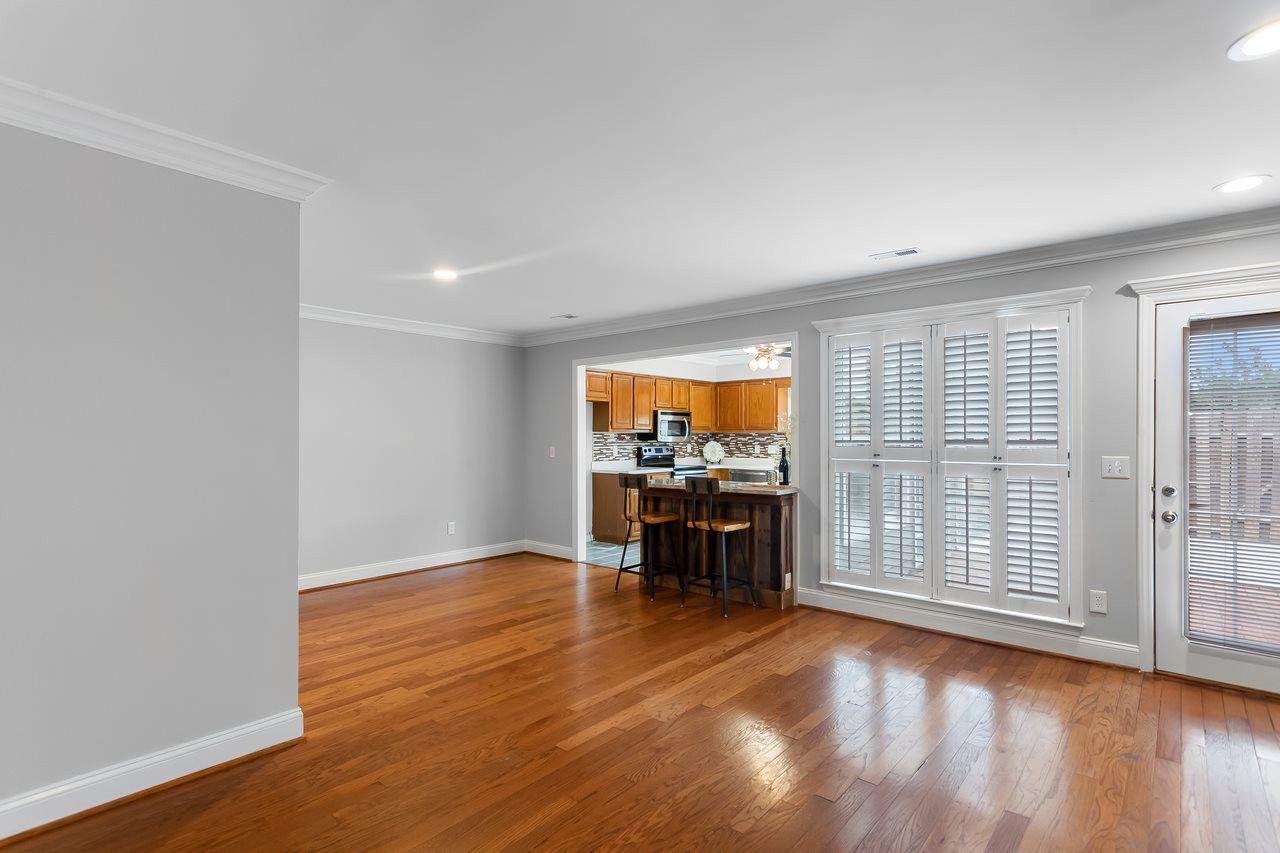 6903 Saxby Court Raleigh, NC 27613 - Photo 2 of 11 The family space boasts hardwood floors, fresh paint, canned lights and plantation shutters. Family Room/Dining Room