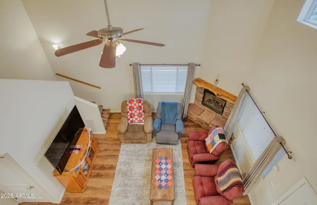 a bedroom with furniture and a wooden floor