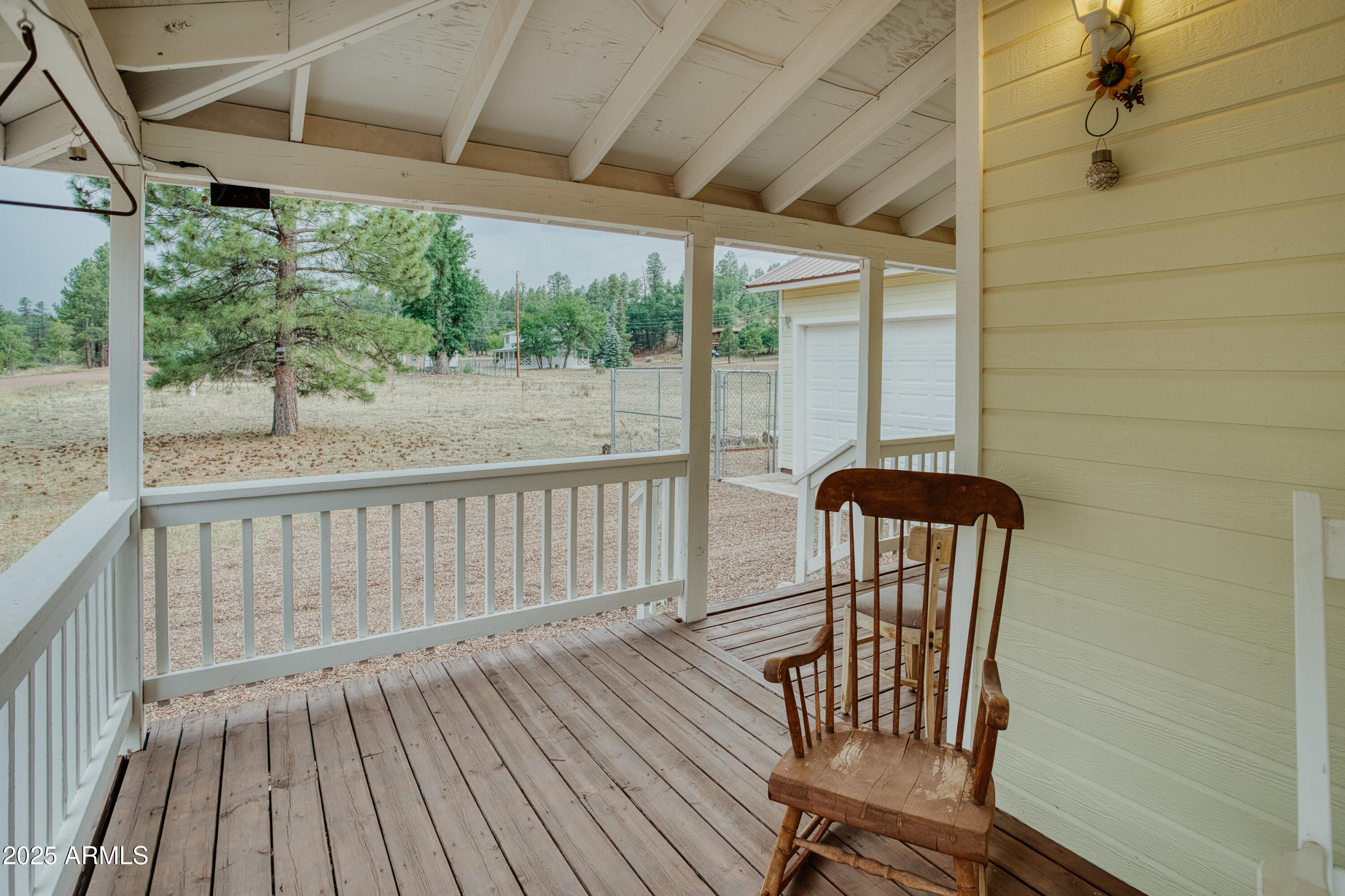 540 Rim Drive Show Low, AZ 85901 - Photo 22 of 35 a view of balcony with wooden floor