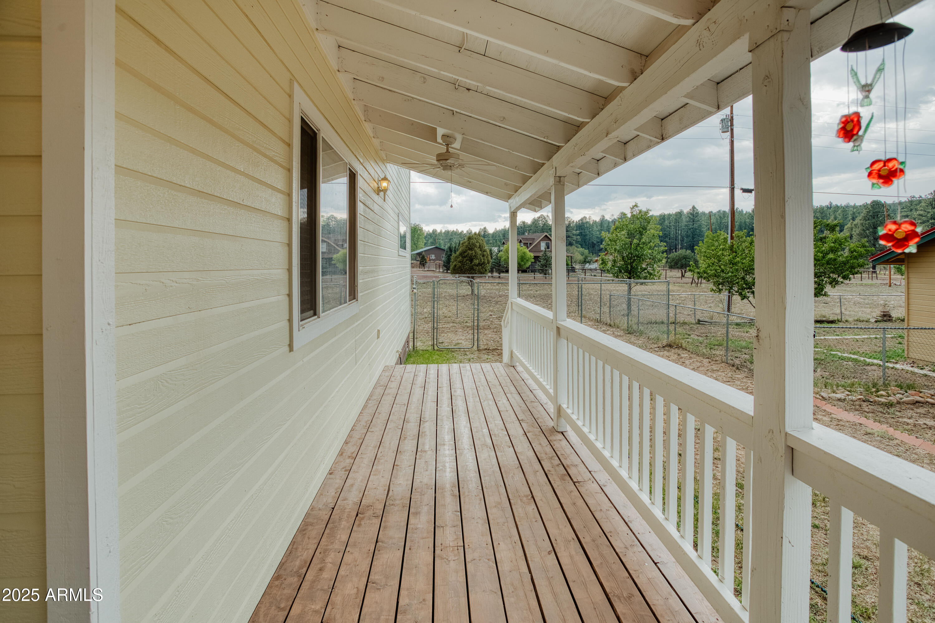 540 Rim Drive Show Low, AZ 85901 - Photo 23 of 35 a view of a balcony with wooden floor